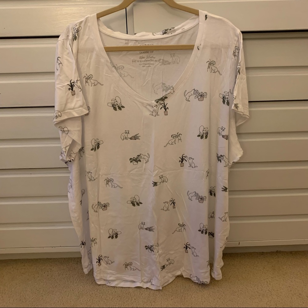 Cat knocking over plant shirt